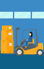 Image showing Warehouse worker moving load by forklift truck.