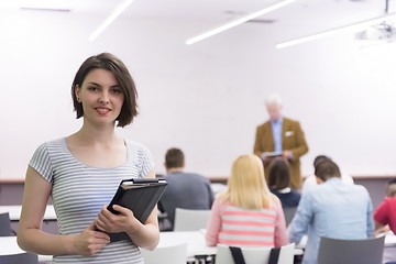 Image showing portrait of happy female student in classroom