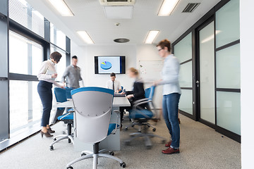 Image showing business people group entering meeting room, motion blur