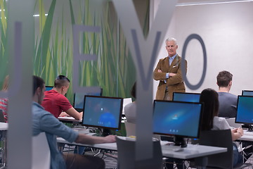 Image showing teacher and students in computer lab classroom