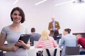 Image showing portrait of happy female student in classroom