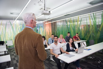 Image showing teacher with a group of students in classroom