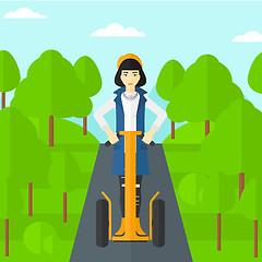 Image showing Woman riding on electric scooter.