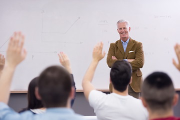 Image showing teacher with a group of students in classroom