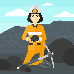 Image showing Miner holding coal in hands.