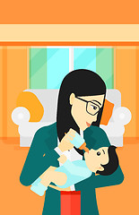 Image showing Woman feeding baby.