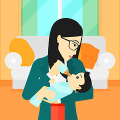 Image showing Woman feeding baby.