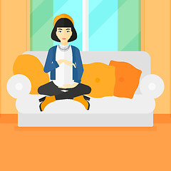 Image showing Pregnant woman sitting on sofa.