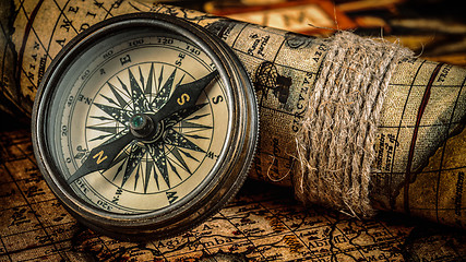 Image showing Old vintage compass on ancient map