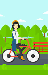 Image showing Woman riding bicycle.