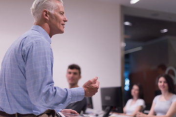 Image showing teacher and students in computer lab classroom