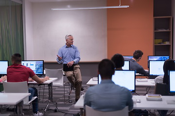 Image showing teacher and students in computer lab classroom