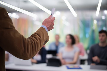 Image showing close up of teacher hand while teaching in classroom