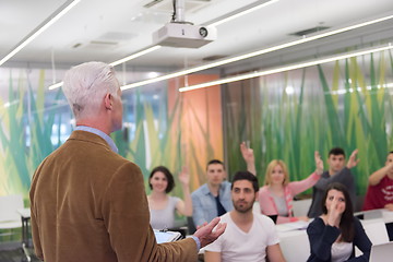 Image showing teacher with a group of students in classroom