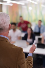 Image showing teacher with a group of students in classroom