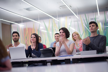 Image showing teacher with a group of students in classroom