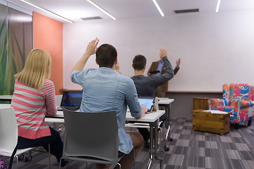 Image showing teacher with a group of students in classroom