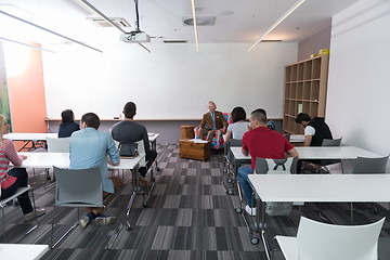 Image showing teacher with a group of students in classroom