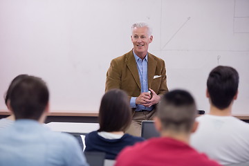 Image showing teacher with a group of students in classroom