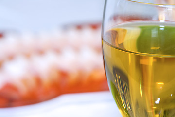 Image showing Shrimps on a Plate with the Wine Glass in Focus