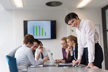 Image showing young  woman using  tablet on business meeting