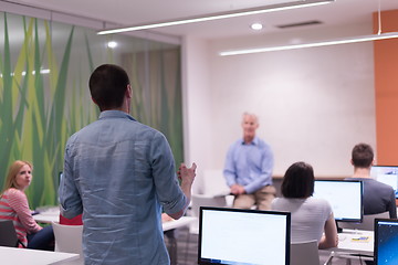 Image showing student answering a question in classroom