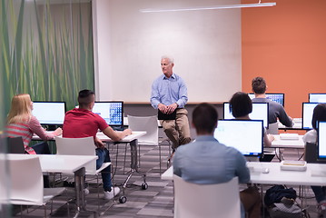 Image showing teacher and students in computer lab classroom