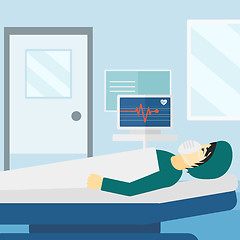 Image showing Patient lying in hospital  bed with heart monitor.