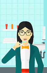 Image showing Woman brushing teeth.