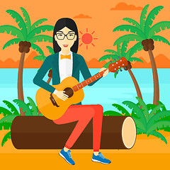 Image showing Woman playing guitar.