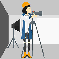 Image showing Photographer working with camera on a tripod.