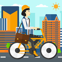 Image showing Woman cycling to work.