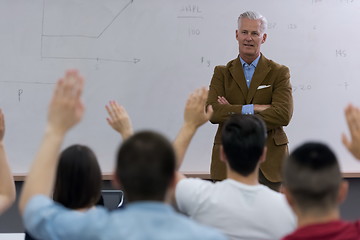 Image showing teacher with a group of students in classroom