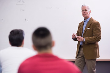 Image showing teacher with a group of students in classroom