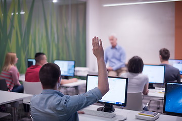 Image showing student answering a question in classroom