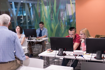 Image showing teacher and students in computer lab classroom