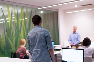 Image showing student answering a question in classroom