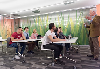 Image showing teacher with a group of students in classroom