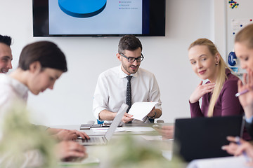 Image showing young business people group on team meeting at modern office