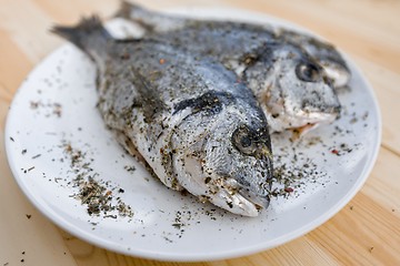 Image showing Cooking fish on the grill