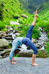Image showing Woman doing yoga asana at waterfall