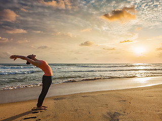 Image showing Woman doing yoga Sun salutation Surya Namaskar 