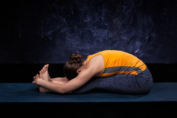 Image showing Sporty woman practices Ashtanga Vinyasa yoga asana 