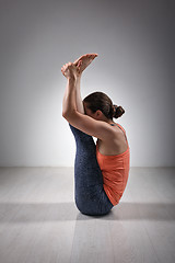 Image showing Sporty woman practices yoga asana Urdhva mukha 