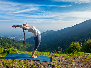 Image showing Woman doing yoga Sun Salutation Surya Namaskar