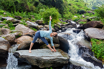 Image showing Woman doing Ashtanga Vinyasa yoga asana  outdoors