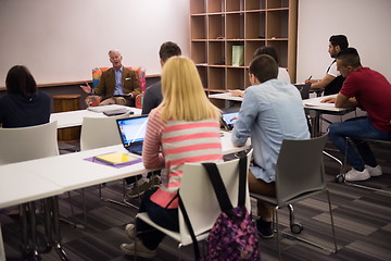 Image showing teacher with a group of students in classroom