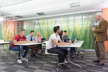 Image showing teacher with a group of students in classroom