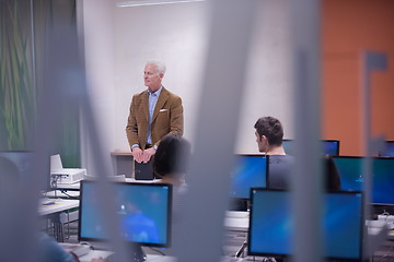 Image showing teacher and students in computer lab classroom