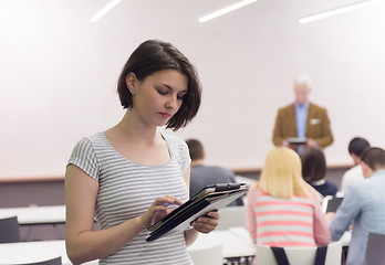 Image showing portrait of happy female student in classroom